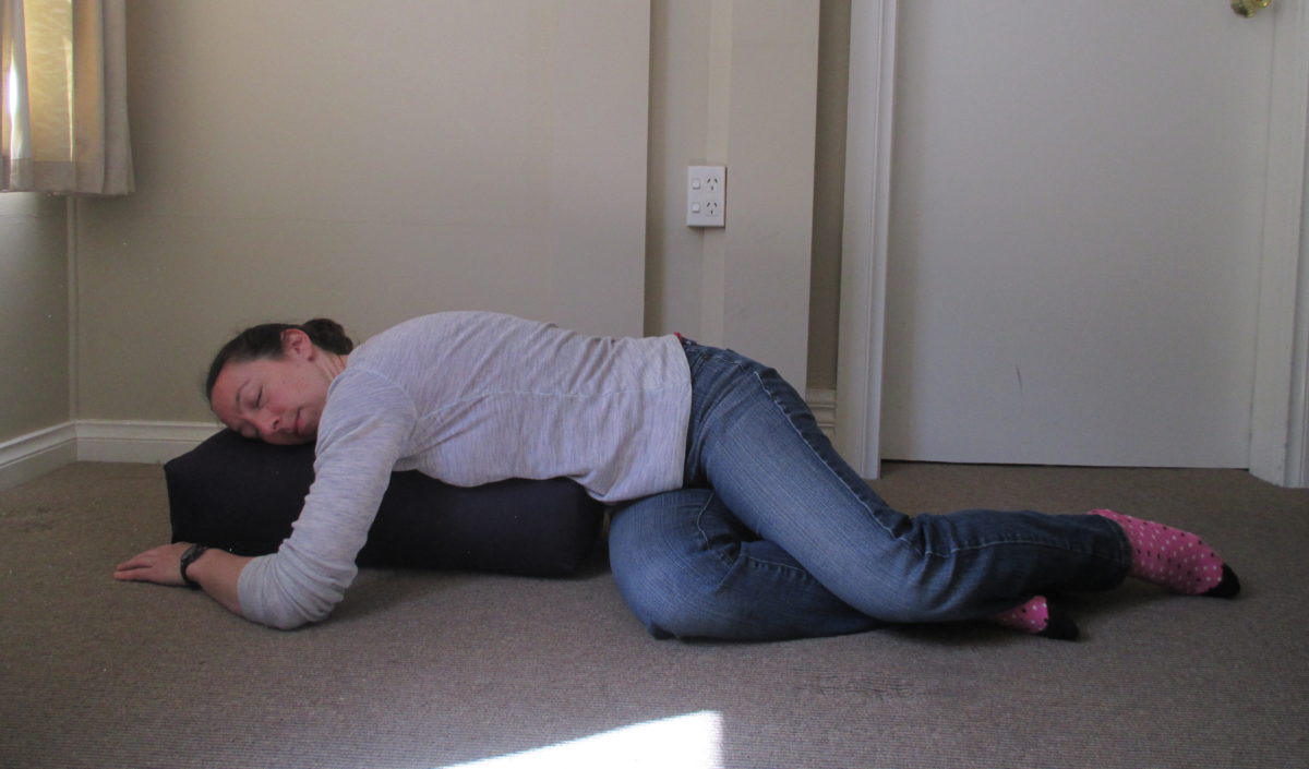 restorative child's pose with a twist