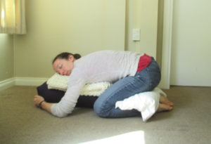 restorative child's pose with knee support