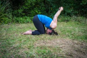 child's pose with shoulder stretch