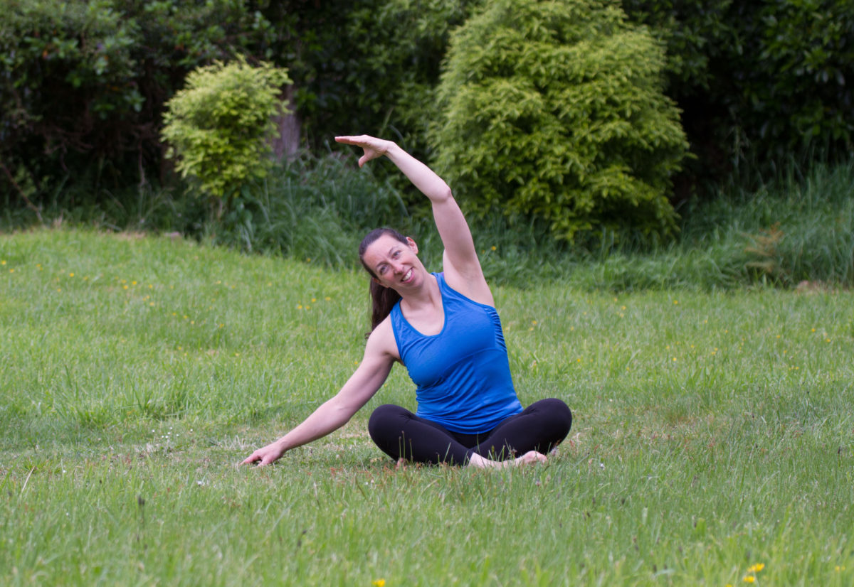 Megan doing a seated side bend