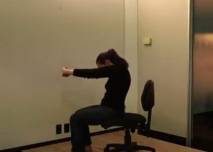 yoga stretch you can do in a chair for the back