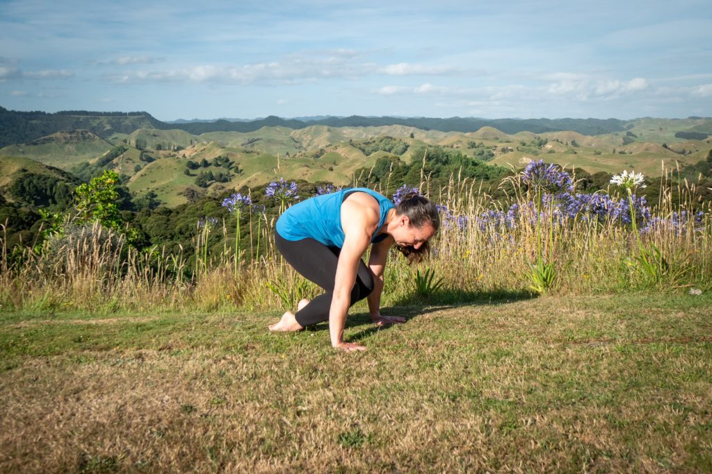 lolasana or pendant yoga pose