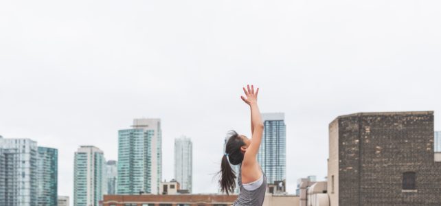 woman doing yoga pigeon pose