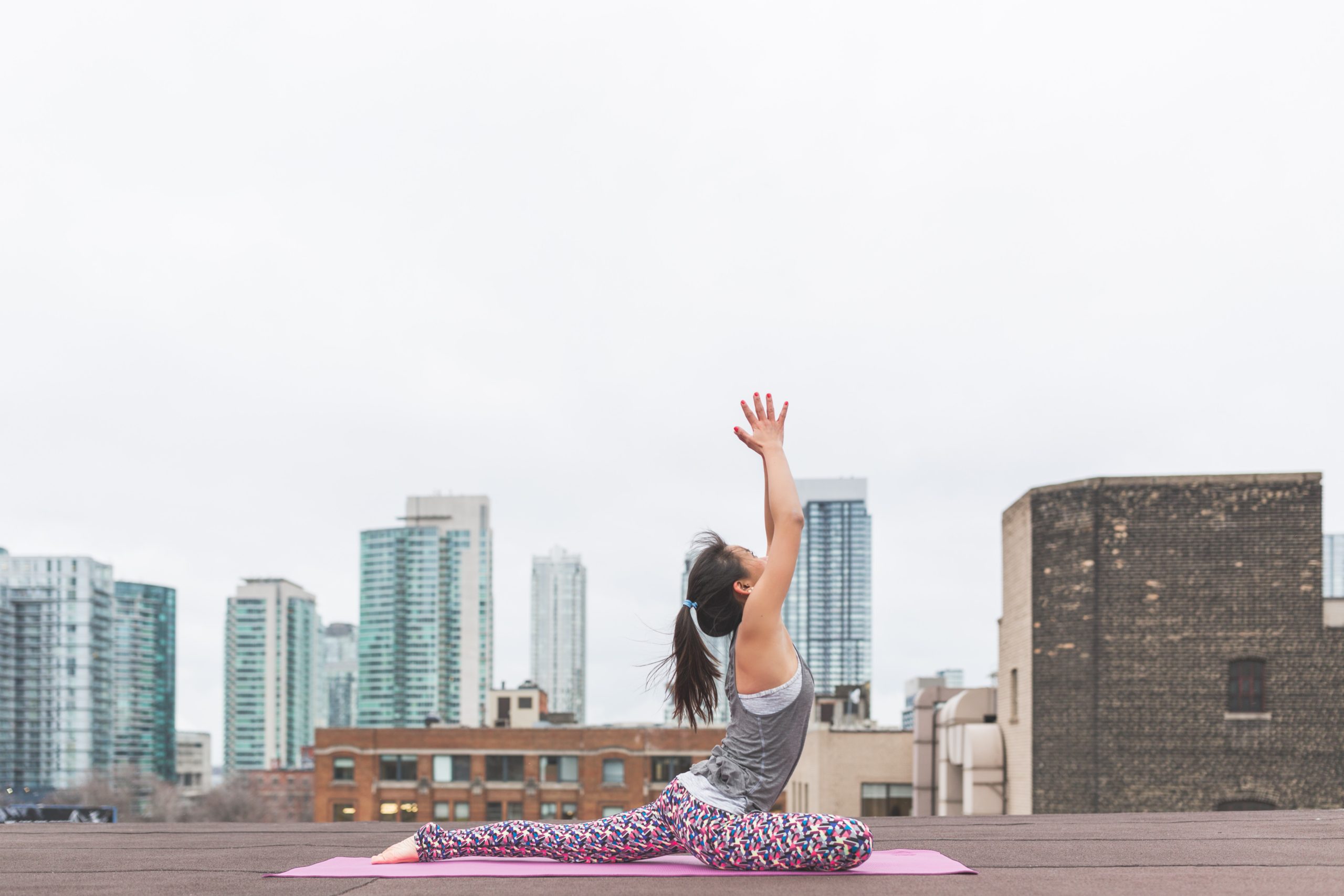 woman doing yoga pigeon pose