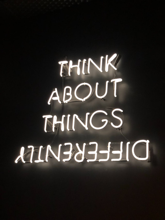 sign that says think about things differently