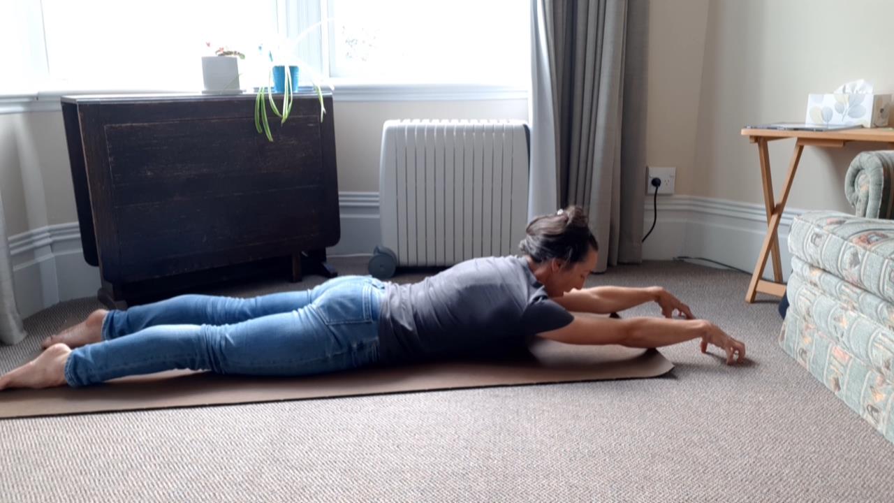 variation of cobra pose with arms stretched out